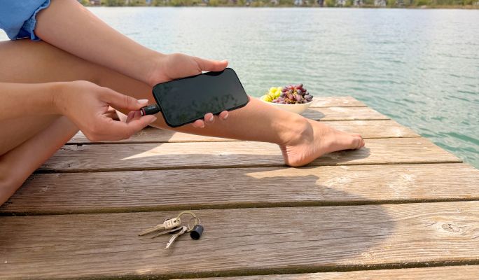 The BiteX Go hangs from a keyring on a pair of jeans.